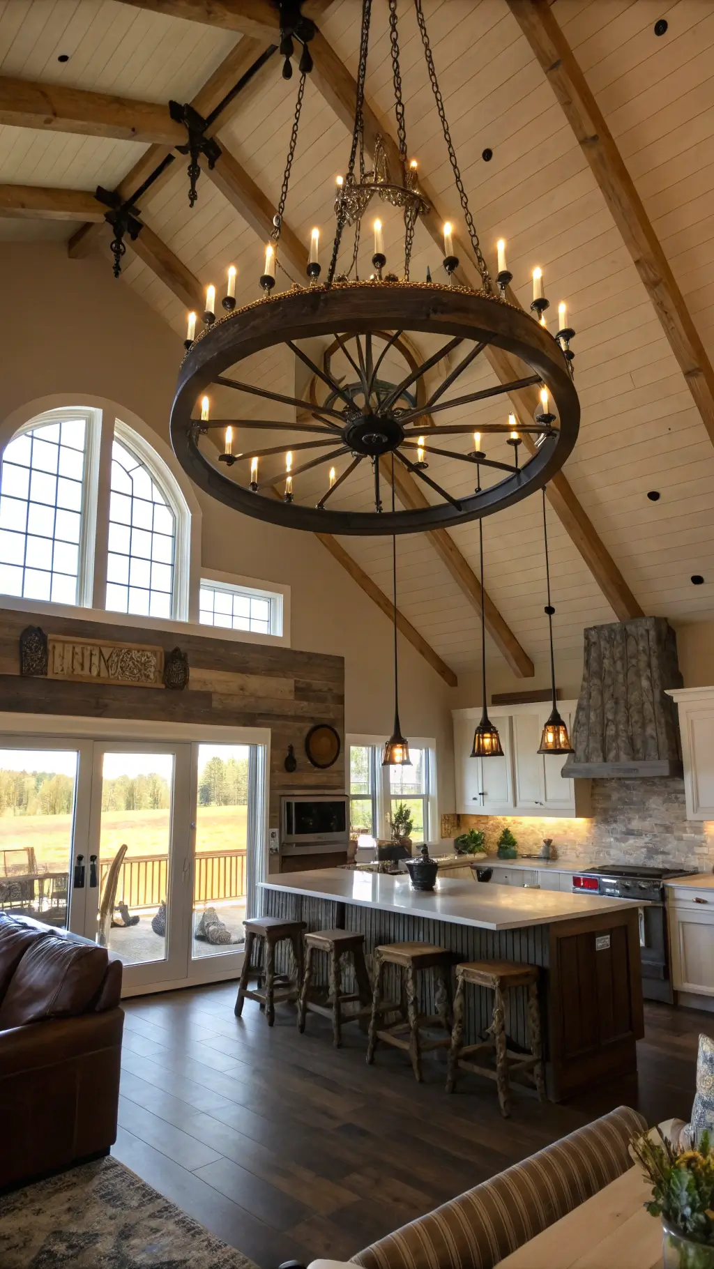 Cathedral ceiling in a spacious open concept kitchen-living area with rustic luxe styling, centered by a grand iron and wood wheel chandelier, reclaimed barn wood accent wall, and arched windows with golden hour lighting.